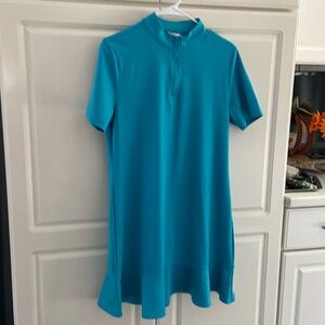 Woman Tommy Bahama golf size, L short sleeve front zipper polyester, & spandex